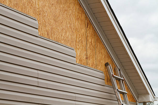 Professional Siding Installation technician working in Sugar Land, TX